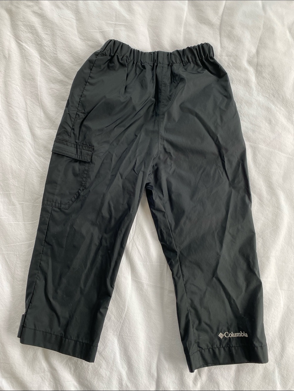 Columbia Black Kids Rain Pants with elastic waistband and adjustable leg cuffs